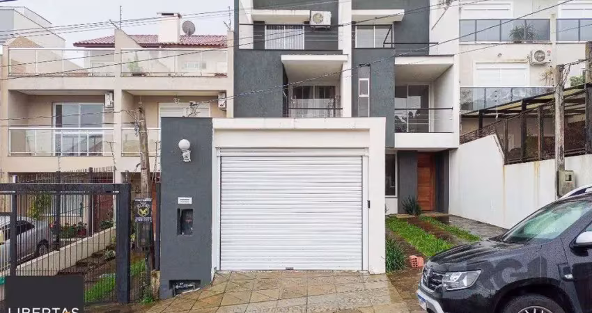 Casa com 3 quartos à venda na Rua Heitor Kramer, 680, Guarujá, Porto Alegre