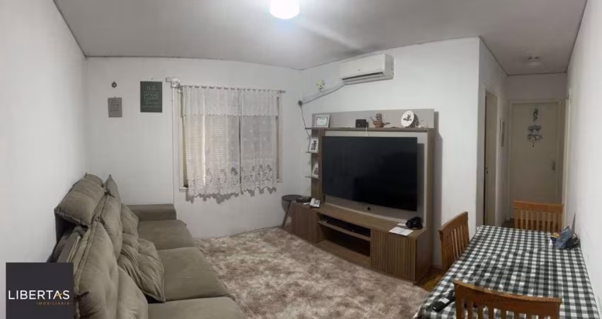 Apartamento de 2 dormitórios, living, cozinha, área de serviço e banheiro social.