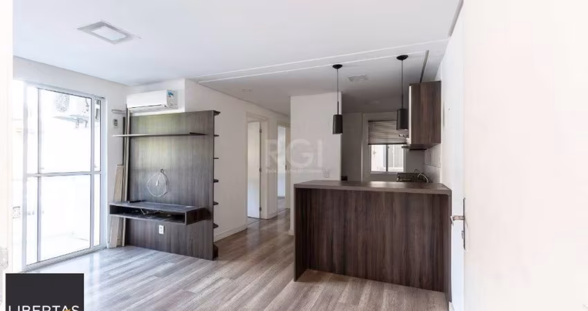 Apartamento 2 dormitórios , sala com dois ambientes , cozinha americana sacada com churrasqueira 1 vaga