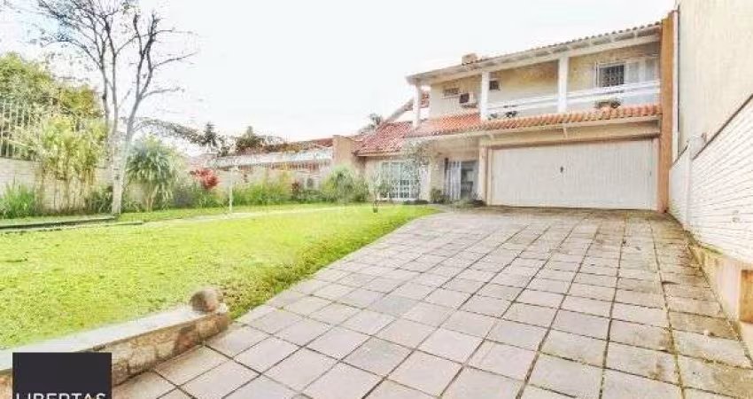 Casa em Porto Alegre, no bairro Jardim Isabel, com 4 dormitório(s), e 4 banheiros, à venda.