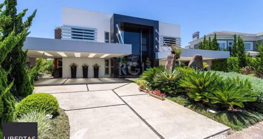 Casa em condomínio fechado com 5 quartos à venda na Avenida Juca Batista, 8000, Belém Novo, Porto Alegre