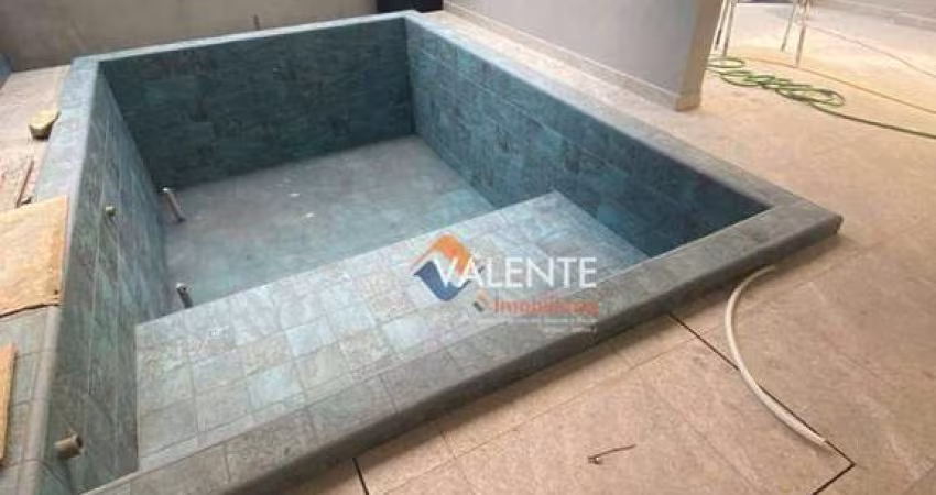 Casa triplex com 2 dormitórios à venda, 118 m² por R$ 983.000 - Canto do Forte - Praia Grande/SP