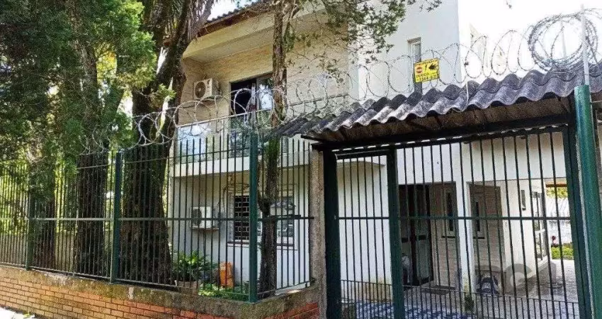 Casa com 3 quartos à venda na Rua Lauro Rodrigues, 590, Costa e Silva, Porto Alegre