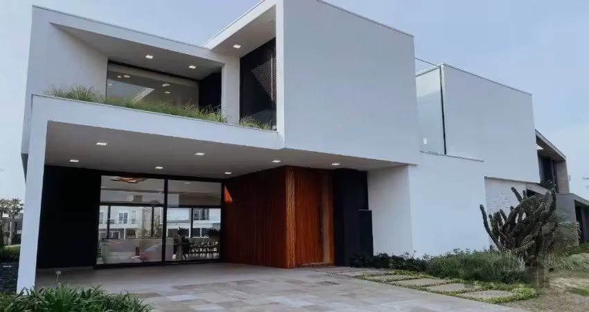 Magnífica mansão a beira lago no cond. enseada - 6 suítes, 8 banheiros e 2 vagas