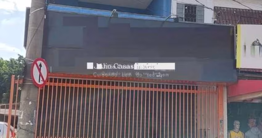 Salão comercial com apartamento e estacionamento a venda
