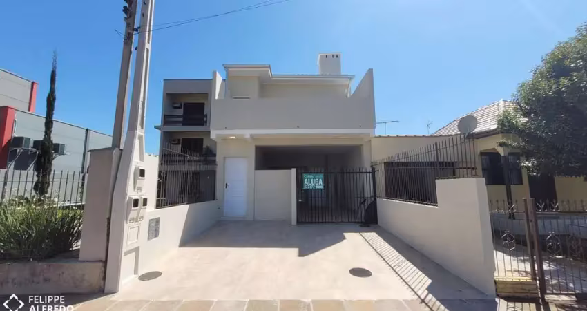 Casa com 2 quartos e 2 vagas para alugar no centro de dois irmãos