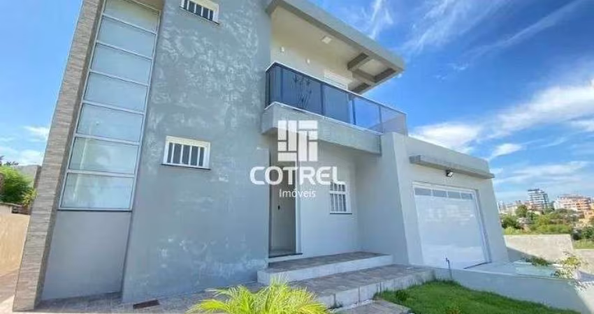Casa à Venda 3 dormitórios, 1 suíte, lareira, 2 vagas de garagem, situada no bai