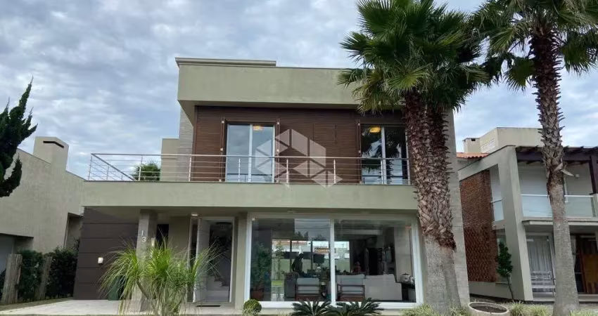 Sobrado com 5 dormitórios, 2 vagas, no condomínio ventura club, xangri-lá/rs