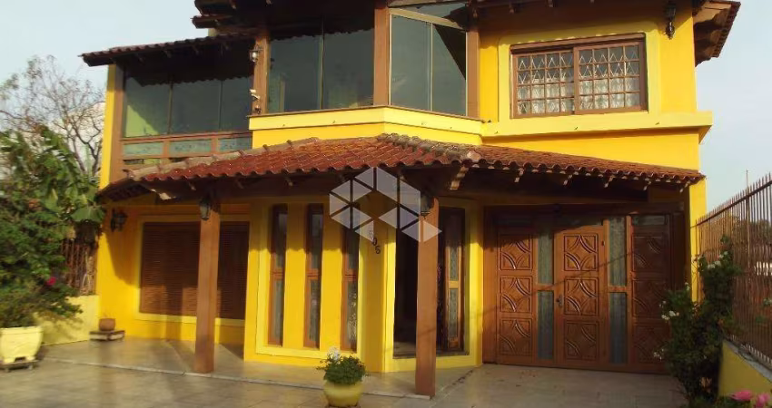 Casa com 4 quartos à venda na Rua Marquês do Maricá, 505, Vila Nova, Porto Alegre