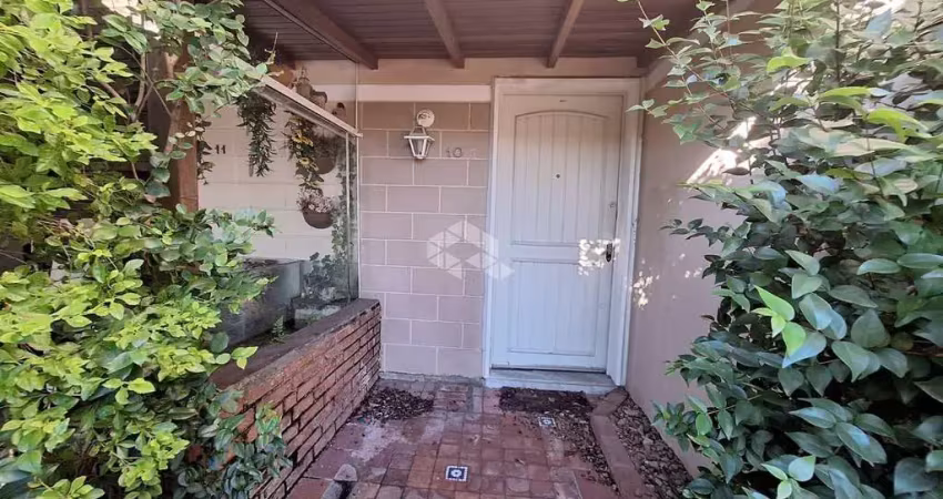 Casa em condomínio com vaga de garagem coberta no bairro igara- canoas. aceita financiamento e fgts.