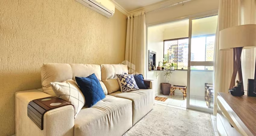 Apartamento 65m² mobiliado com 2 dormitórios, 1 vaga de Garagem, sacada com churrasqueira integrada ao living, a venda no Centro, aceita financiamento