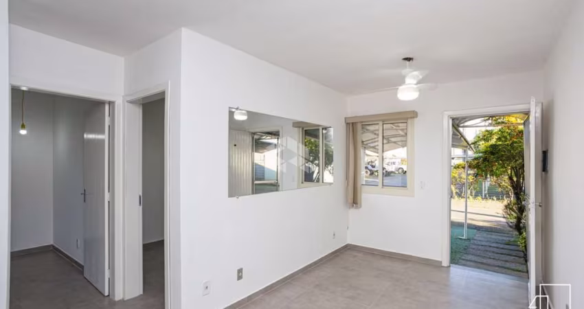 Casa condomínio,  2 dormitórios, living com 3 ambientes, sala de estar, jantar e cozinha, 2 vagas de garagem, a venda