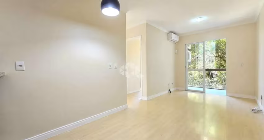Apartamento com 2 Dormitórios/Quartos , living para 2 ambientes e uma sacada com churrasqueira, 1 vaga de garagem coberta no bairro Marechal Rondon