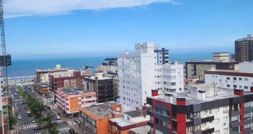 Três dormitórios mobiliado andar alto  no centro de Capão da Canoa RS