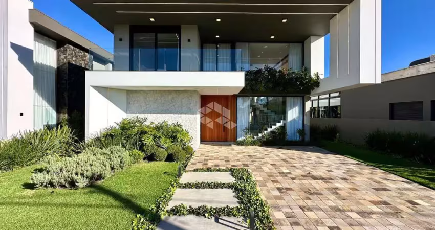 Casa no ilhas resort com 05 suítes ,417 m² de área construída.capão da canoa