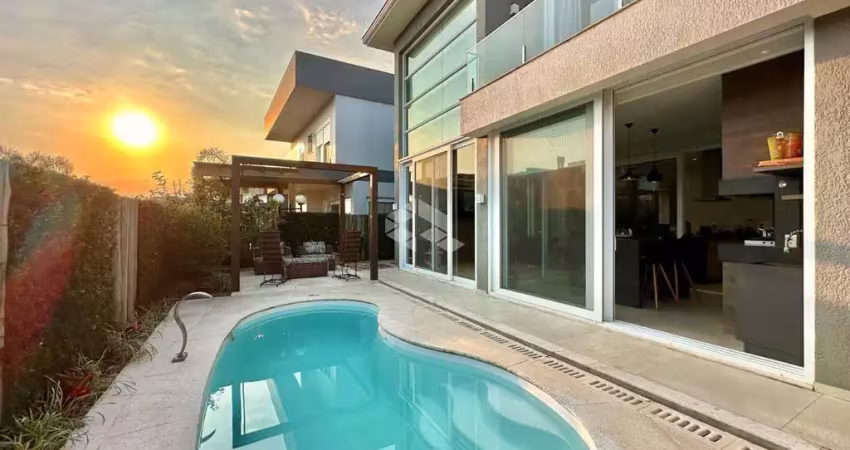 Sobrado condomínio capão ilhas , 05 dormitórios ,04 suítes uma no térreo e uma com closet , 312m² área construída,capão da canoa!