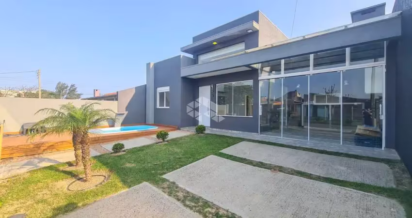 Sobrado 3 dormitórios, 1 suíte, 2 banheiros, living integrado amplo, churrasqueira, com garagem, no bairro araça em capão da canoa!