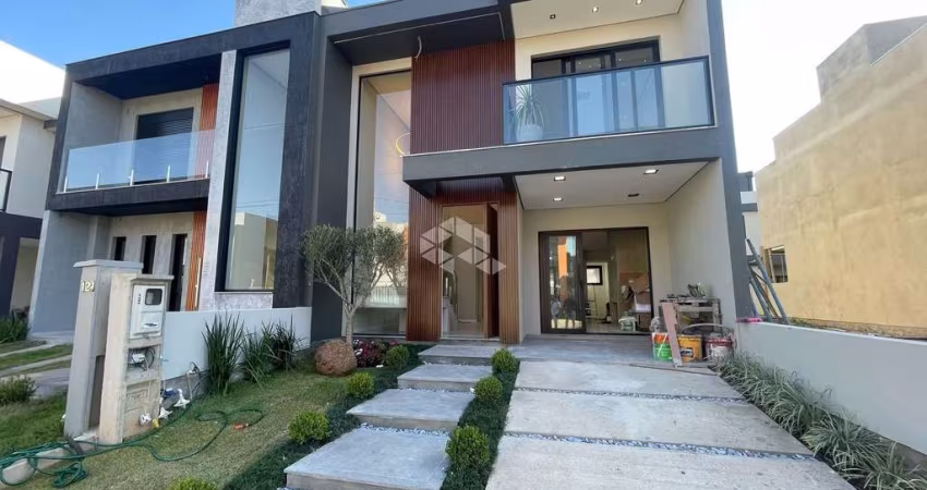 Alto padrão no Central Square - Gravataí! Casa com 138m², 3 dormitórios (1 suíte), lareira, churrasqueira, cozinha planejada, iluminação completa e ja