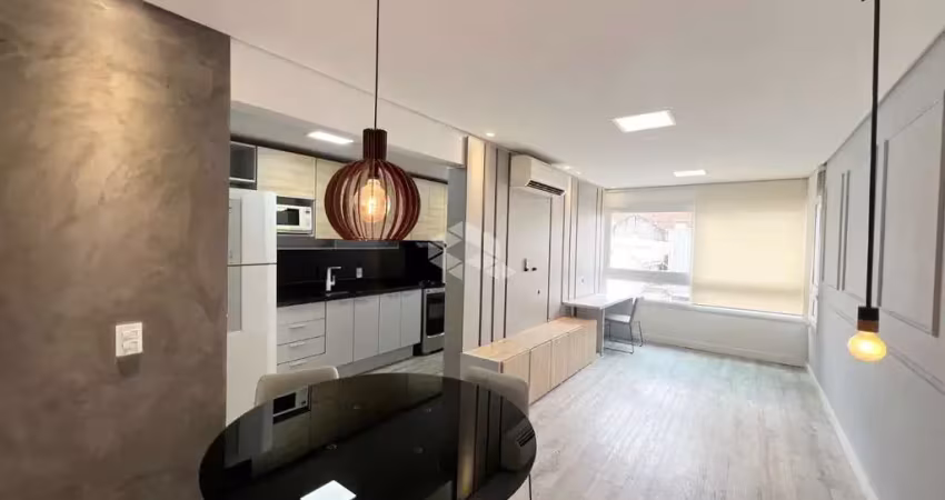 Apartamento mobiliado com 1 dormitório com suíte e vaga coberta  coberta -centro