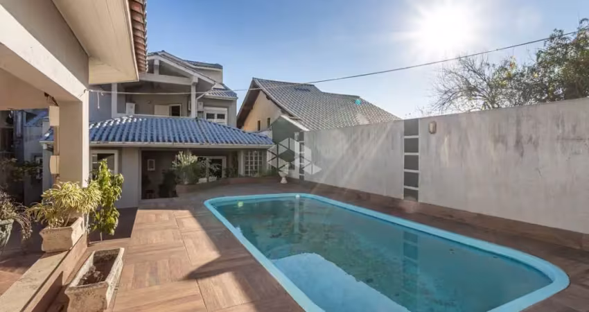 Casa com 4 quartos à venda na Bortolo Barbieri, 67, Jardim São Pedro, Porto Alegre