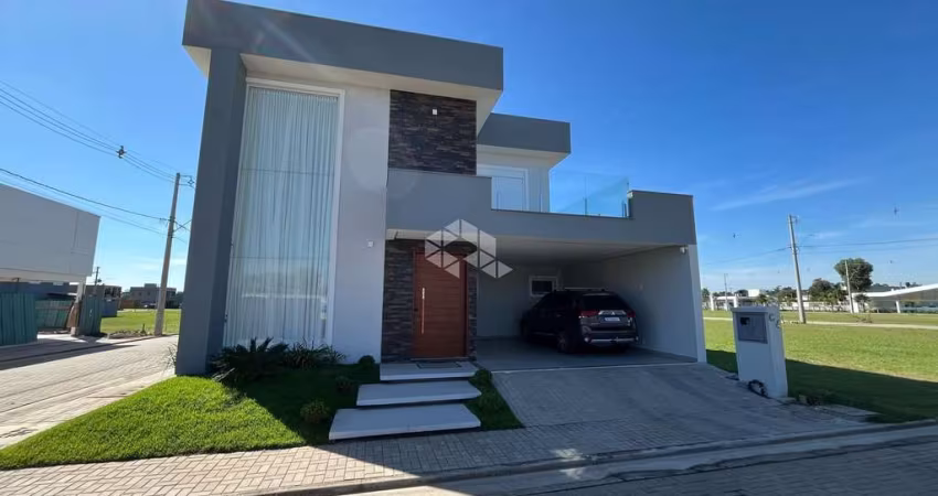 Casa à venda em condomínio fechado em Eldorado do Sul com 3 dormitórios e 2 vagas