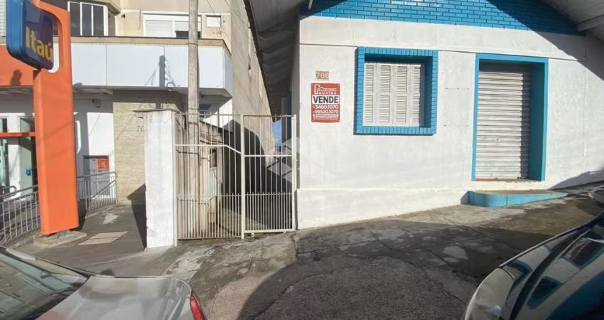 Ótimo ponto comercial à venda no centro de Guaiba. Nos fundos casa 1 dormitório.