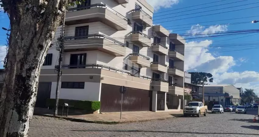 Apartamento de dois dormitórios e vaga de garagem no centro de vacaria