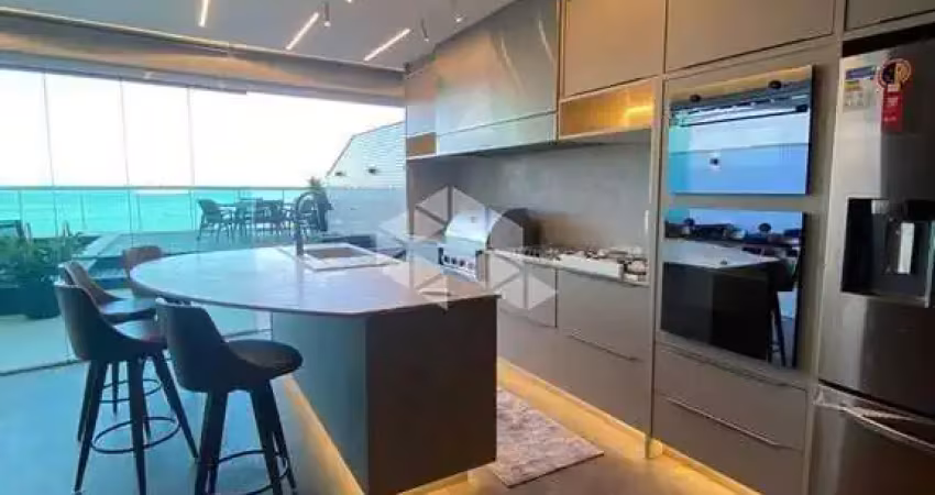 Apartamento  frente mar com 04 dormitórios sendo 04 suítes com 04 vagas de garagem