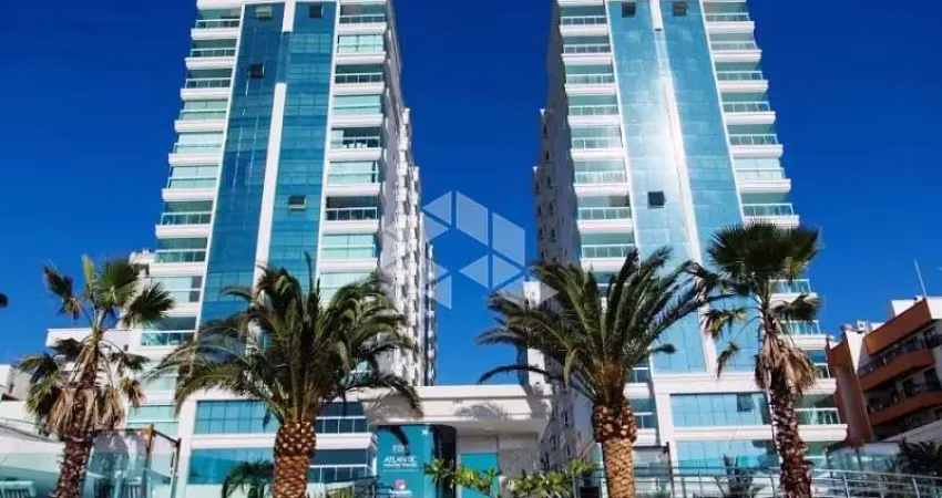 Apartamento com 4 suítes e 3 vagas de garagem em itapema condomínio pé na areia