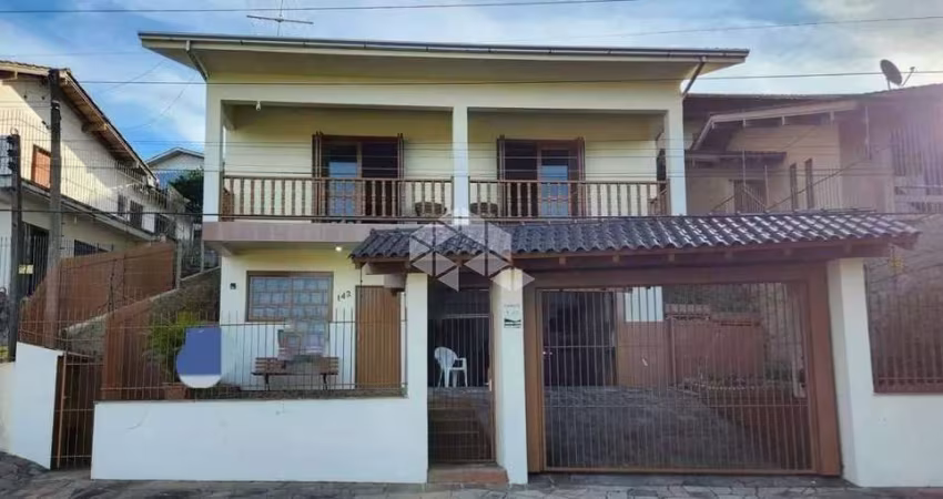 Casa a venda no bairro Primavera em Novo Hamburgo/RS, 3 dormitórios sendo 1 suíte, Aceita financiamento bancário.