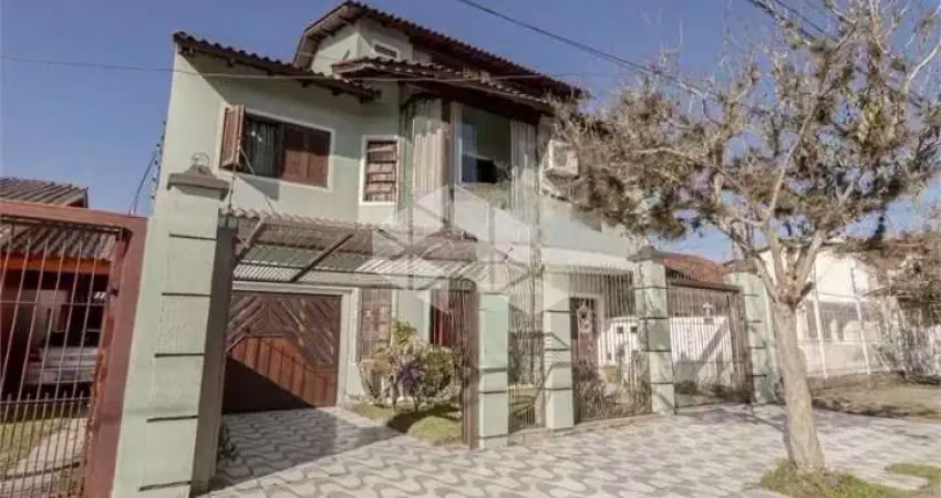 Casa com 4 quartos à venda na Rua Doutor Telmo Vergara, 556, Partenon, Porto Alegre