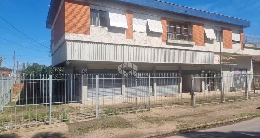 Excelente Prédio com Amplo Apartamento com 3 dormitórios, suíte no segundo andar com garagem e 3 lojas grandes no térreo em avenida no bairro Sarandi