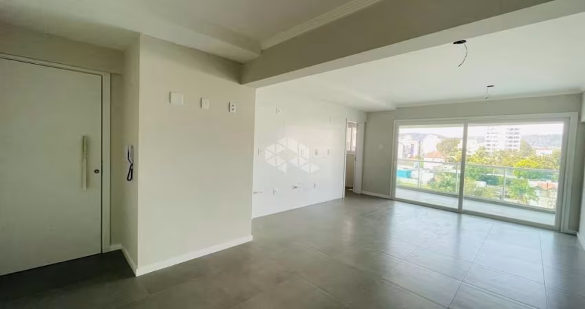 APARTAMENTO CENTRAL COM DOIS DORMITÓRIOS