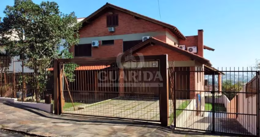 Casa com 6 quartos à venda na Rua Altos da Amapá, 170, Vila Nova, Porto Alegre