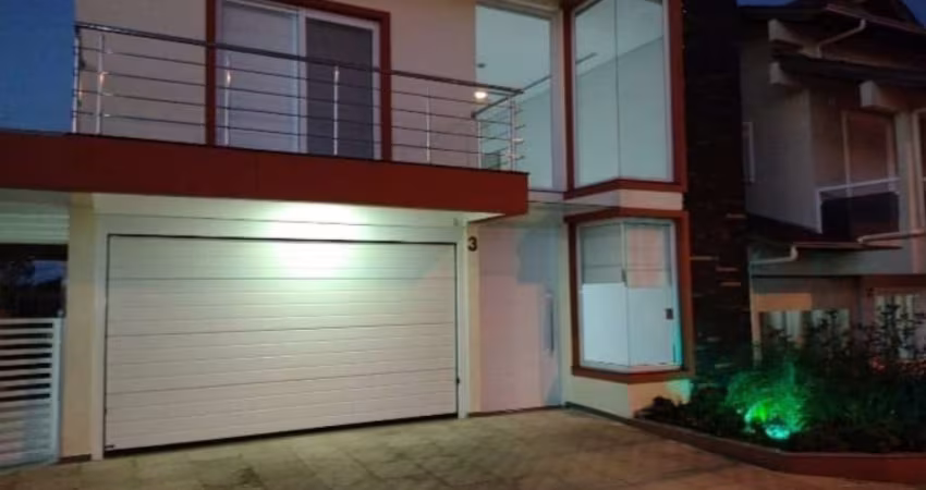 Casa em condomínio fechado com 4 quartos para alugar na Rua Antônio Baggio, 40, Loteamento Jardim Timbaúva, Gravataí