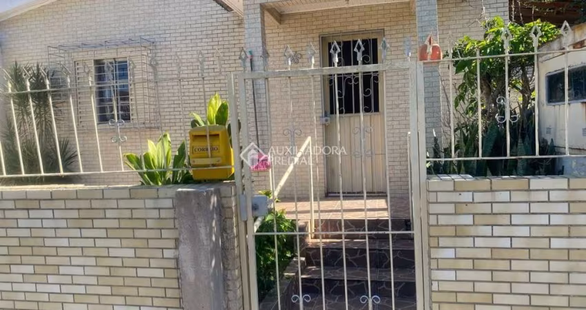 Casa com 5 quartos à venda na Rua Itacurubi, 35, Vila Nova, Porto Alegre