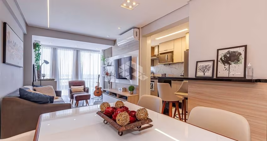 Apartamento com três quartos, duas vagas e churrasqueira