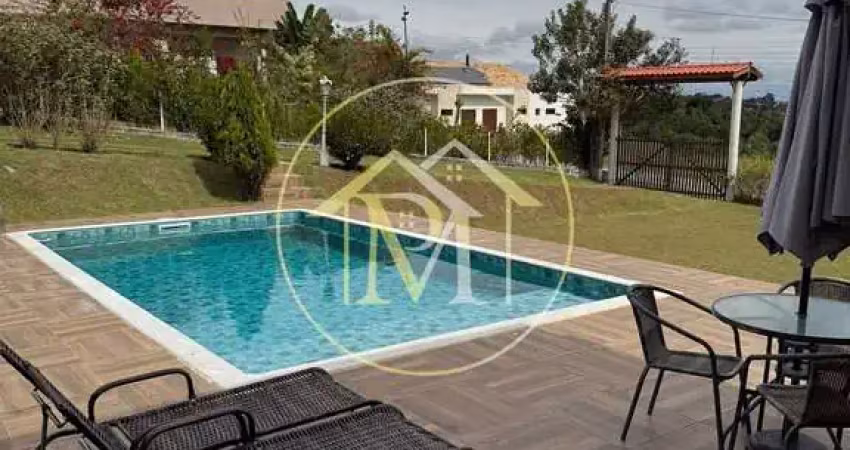 Chácara  em condomínio fechado com 1.200 m² de terreno, 320 m² de área construída e piscina de 50 m