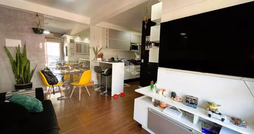 Apartamento térreo a venda com 55 m²,  semi-mobiliado, 2 dormitórios, churrasqueira e 1 vaga na Cavalhada