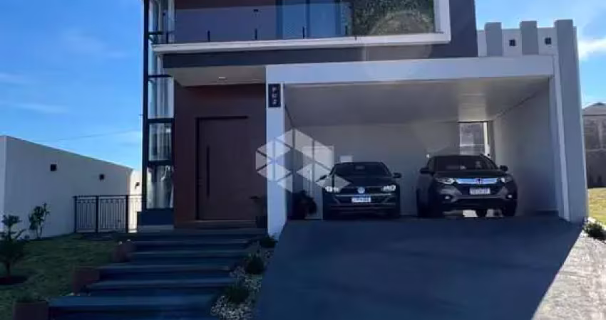 Casa a venda em condomínio fechado com 3 quartos, uma suíte, em santa maria