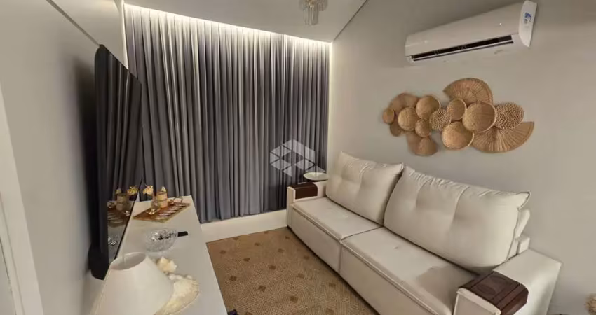 Apartamento a 50 metros da praia da daniela com 2 quartos e 1 vaga de garagem