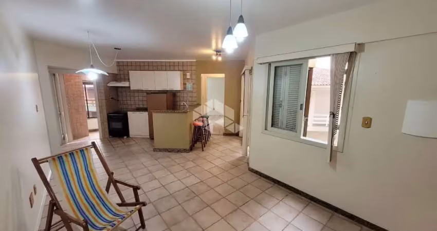 Apartamento a venda com 01 dormitório, sala, com sacada fechada, cozinha, área de serviço com churrasqueira, e box coberto