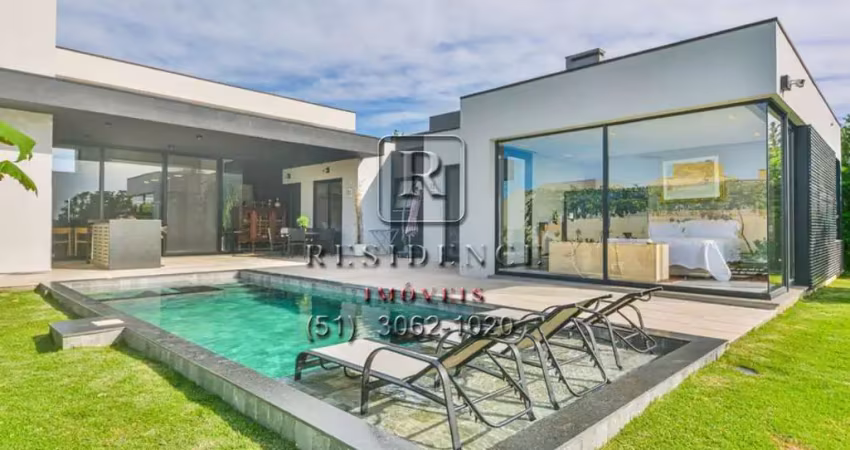 Luxuosa casa em condomínio à venda em Belém Novo, Porto Alegre-RS: 4 quartos, 4 suítes, áreas amplas e piscina aquecida!