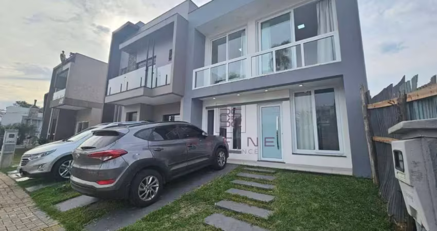Sobrado com 3 dormitórios à venda, 105 m² por R$ 790.000,00 - Condomínio Primavera - Gravataí/RS
