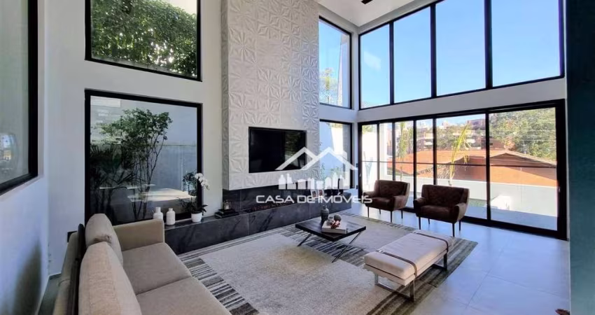 Vende magnífica casa em condomínio com 4 suítes, piscina, academia e muita luz natural no Jardim Vitória Regia.