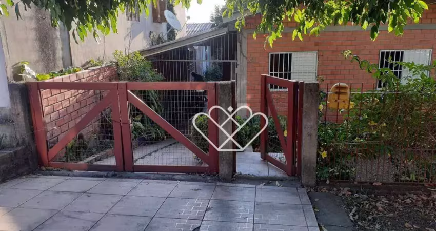 Casa aconchegante com quintal e 2 dormitórios em região tranquila