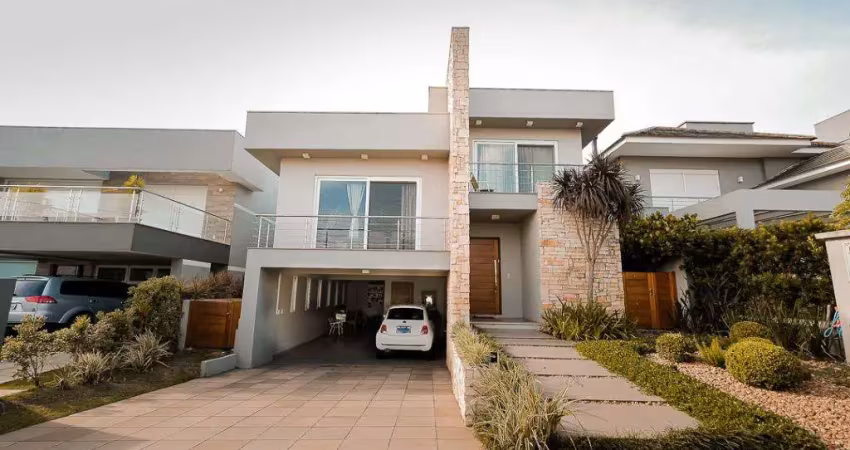 Casa de alto padrão no residencial alphaville em gravataí com 3 suítes e piscina