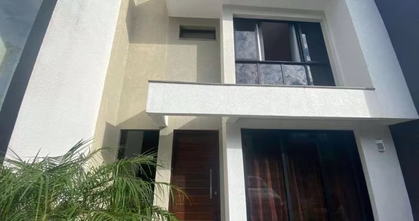 Sobrado com 3 dormitórios para alugar, 112 m² por R$ 6.735,00/mês - Primavera - Gravataí/RS