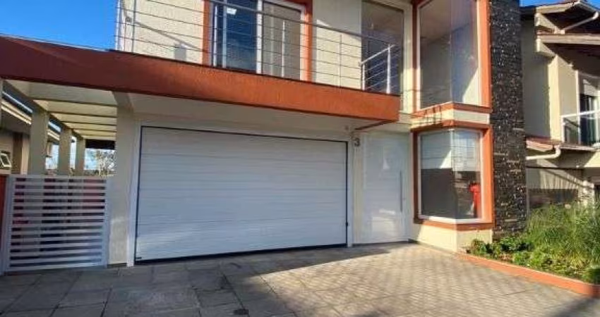 Sobrado com 4 dormitórios para alugar, 180 m² por R$ 7.230,00/mês - Loteamento Jardim Timbaúva - Gravataí/RS