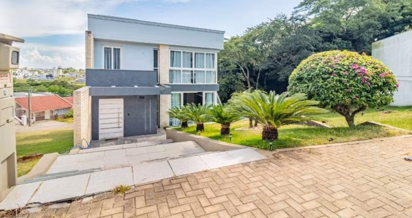 Sobrado com 4 dormitórios para alugar, 380 m² por R$ 8.610,00/mês - Loteamento Jardim Timbaúva - Gravataí/RS